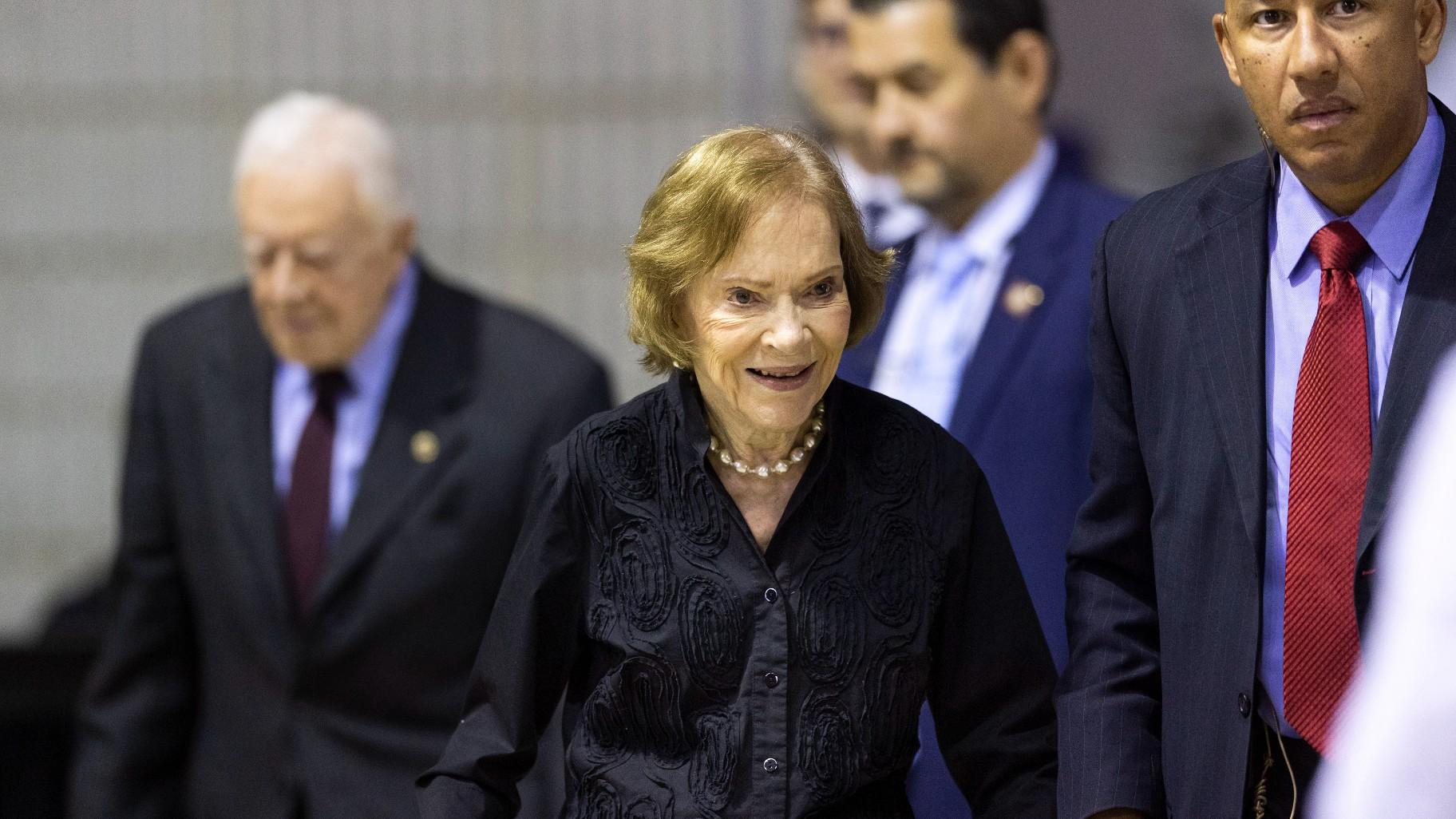Former first lady Rosalynn Carter arrives with her husband, former President Jimmy Carter, left, for an annual Carter Town Hall held at Emory University, Sept. 18, 2019, in Atlanta. Rosalynn Carter, the closest adviser to Jimmy Carter during his one term as U.S. president and their four decades thereafter as global humanitarians, died Sunday, Nov. 19, 2023. She was 96. (AP Photo/John Amis, File)